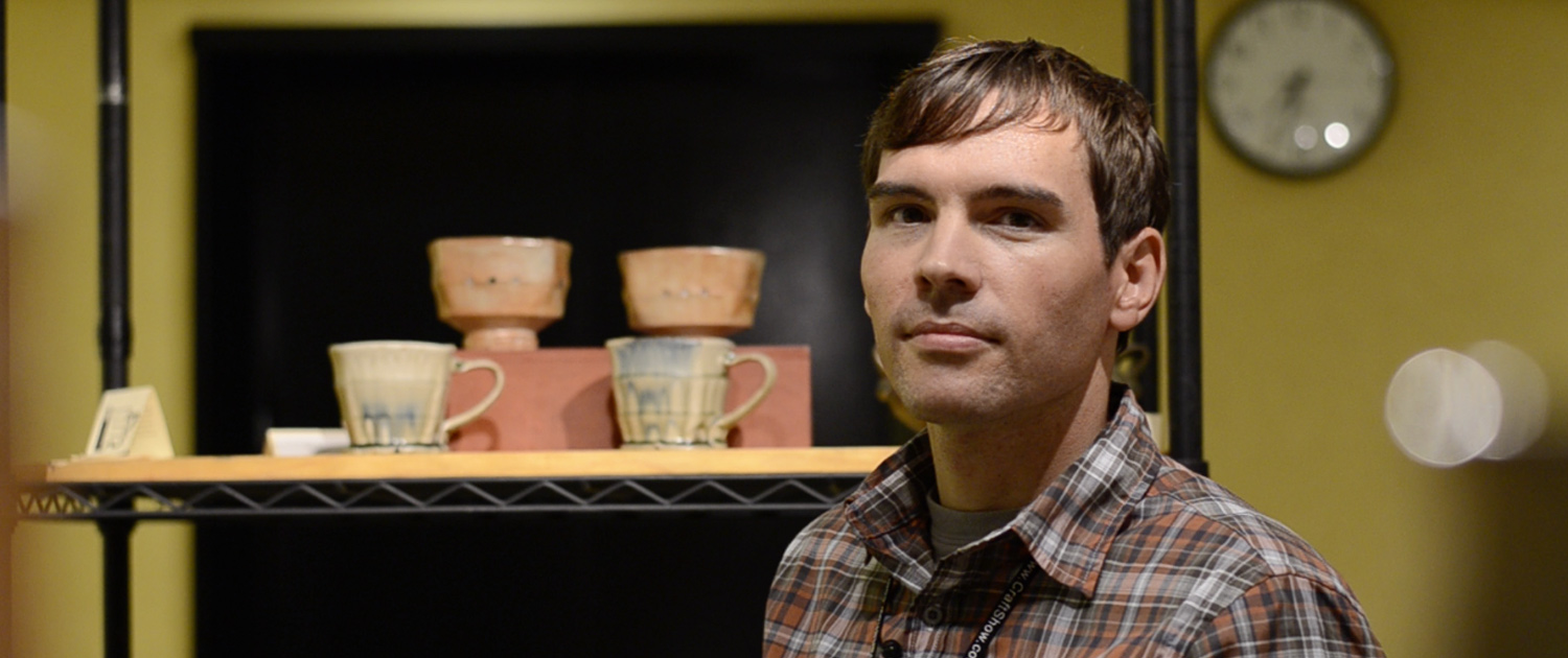 Bradley-B-Pottery Bradley B with ceramics in the background