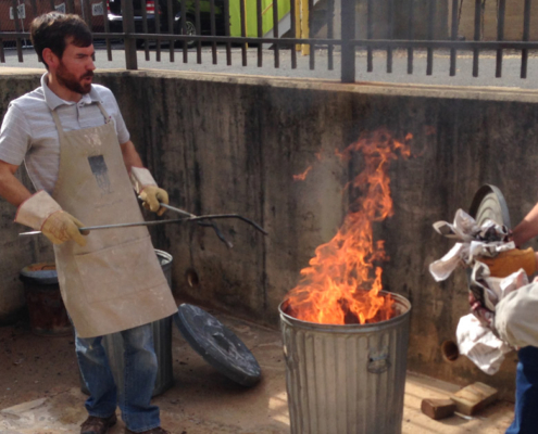 Bradley-B-Potter-Raku-Firing-Clinics Bradley working with students during raku firing