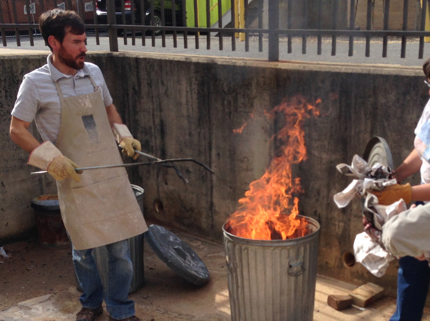 Bradley-B-Potter-Raku-Firing-Clinics Bradley working with students during raku firing